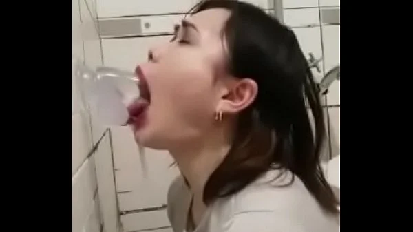 Asian deepthroating a dildo